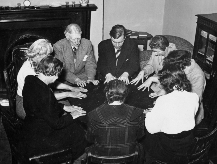 a group of CIA psychics at a round table